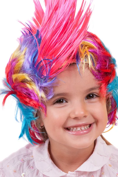 Little girl with colorful wigs — Stock Photo, Image