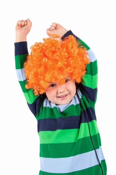 Smiling little boy listening to music in headphon — Stock Photo, Image