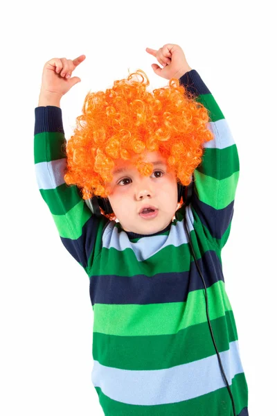 Smiling little boy listening to music in headphon — Stock Photo, Image