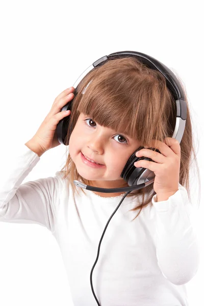 Little girl listening to music — Stock Photo, Image