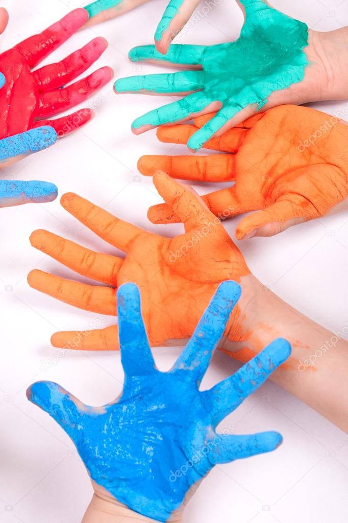 Child paints with hand