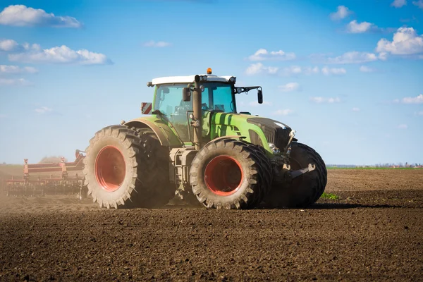 Tractor in the field sow — Stock Photo, Image