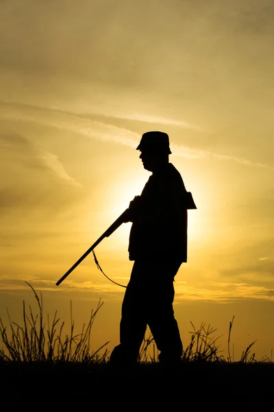 Hunter in the sunset — Stock Photo, Image