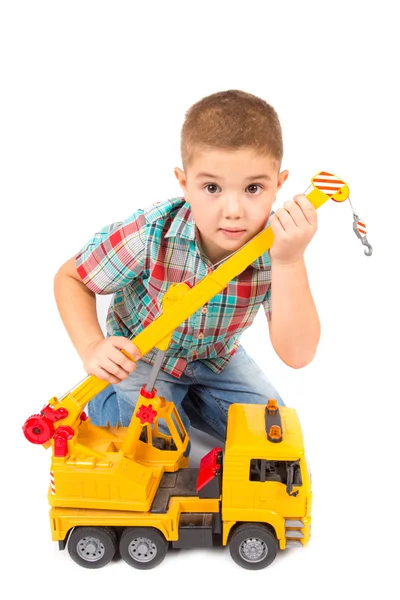 Little boy plays with toy truck — Stock Photo, Image