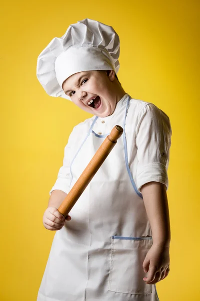 Pequeno menino chef em uniforme — Fotografia de Stock