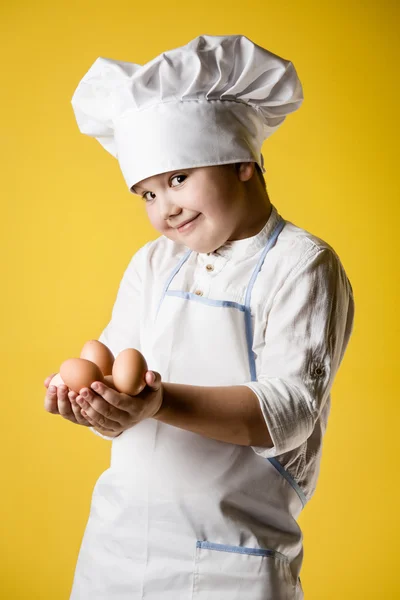 Malý kuchař chlapec v uniformě — Stock fotografie