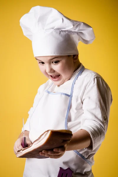 Pequeno menino chef em uniforme — Fotografia de Stock