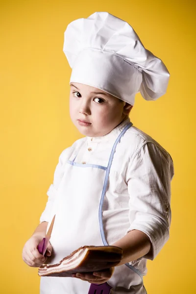 Liten pojke kock i uniform — Stockfoto