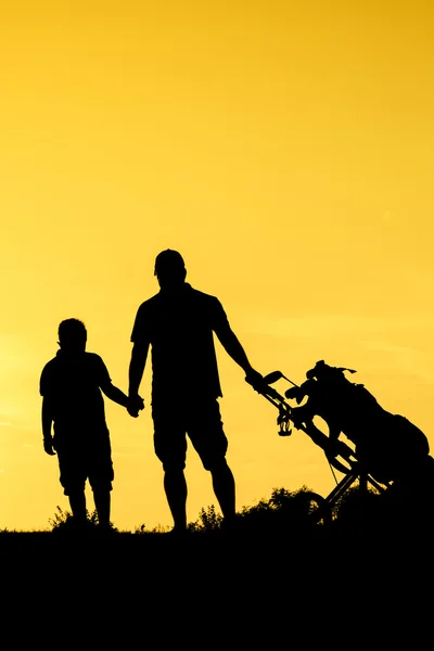 Golfer at sunset — Stock Photo, Image