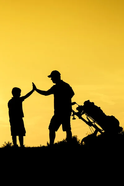 Golfer at sunset — Stock Photo, Image