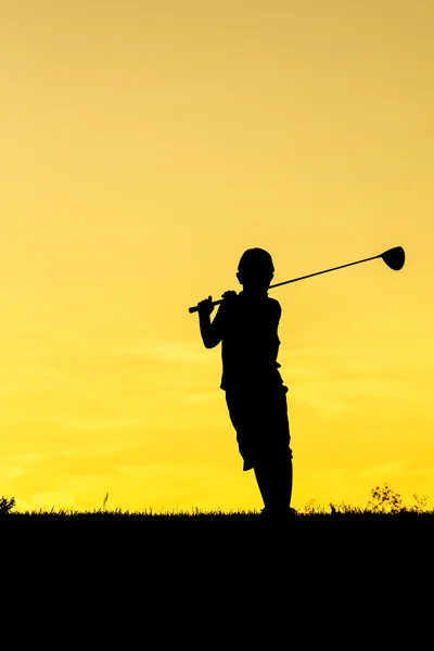 Golfer bij zonsondergang — Stockfoto