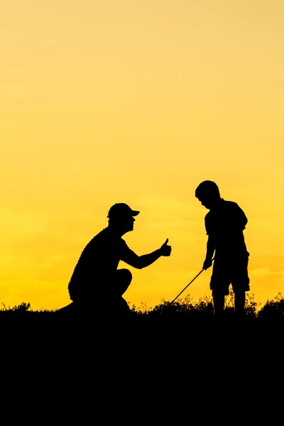 Golfeur au coucher du soleil — Photo