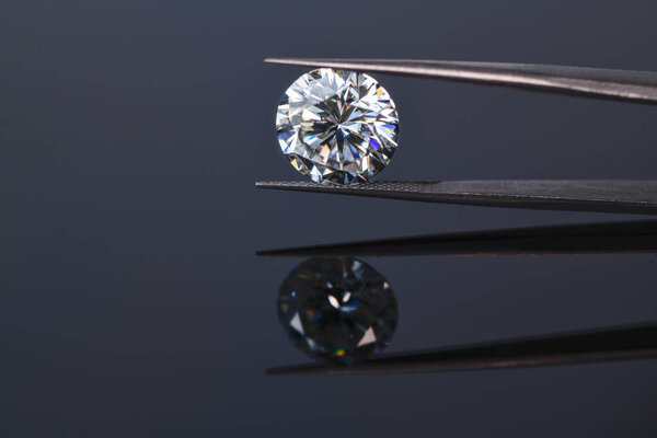 Precious Diamond Gemstone in Jewelry Tweezers