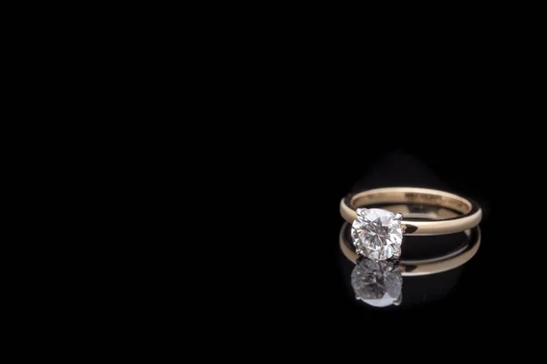 Solitaire Wedding Ring With Diamond on Reflected Background