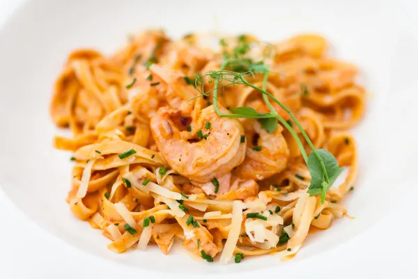 Pasta with salmon and shrimps — Stock Photo, Image