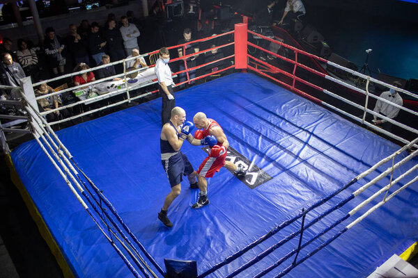 Bout between Burka Pavel and Bogdanov Dmitry in the weight category up to 75 kg during Boxing Kharkiv Derby, located in Victory Concert Hall, Kharkov, Ukraine, 03.12.2021