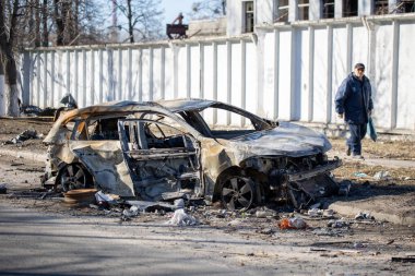 View of burnt car on one of the streets in Kharkiv after rocket bomb attack by Russian occupying military. Russian army aviation forces bombed civilian objects. War of Russia against Ukraine. 21.03.2022, Kharkiv, Ukraine