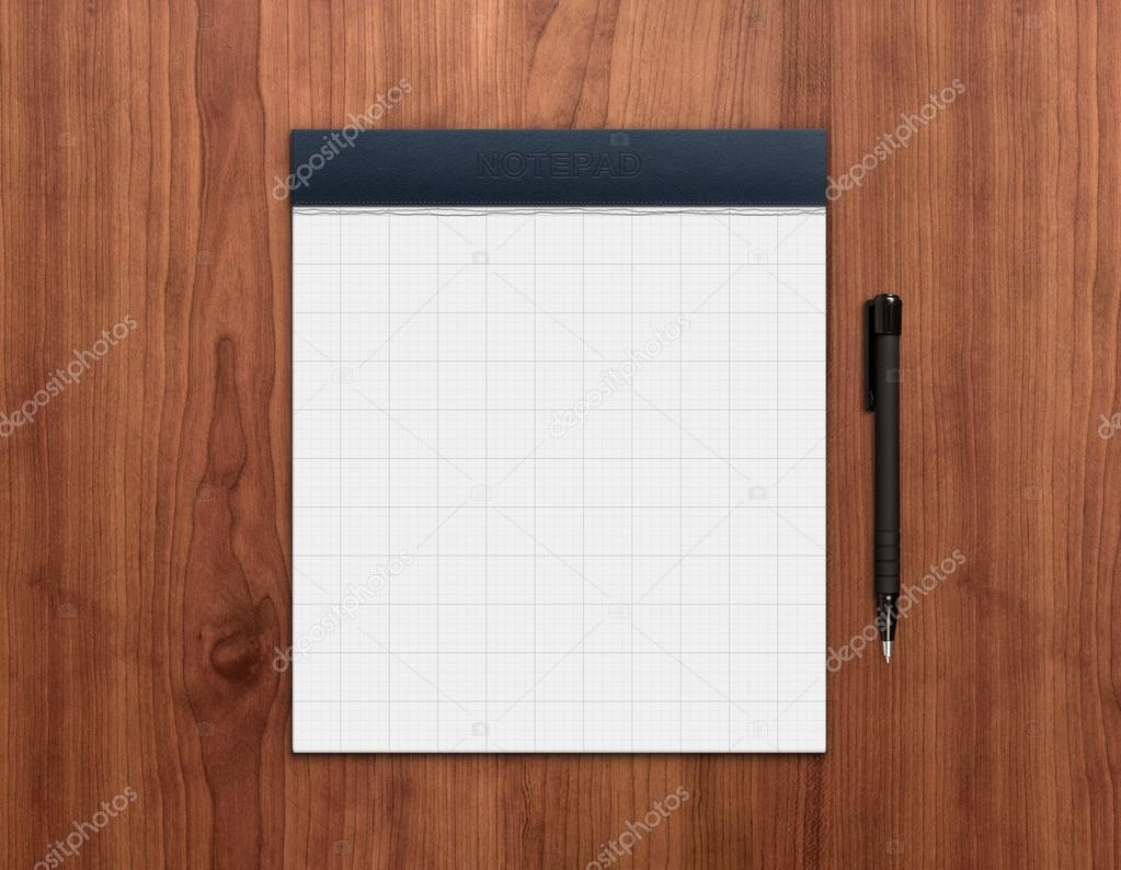 Notepad with pen on desk