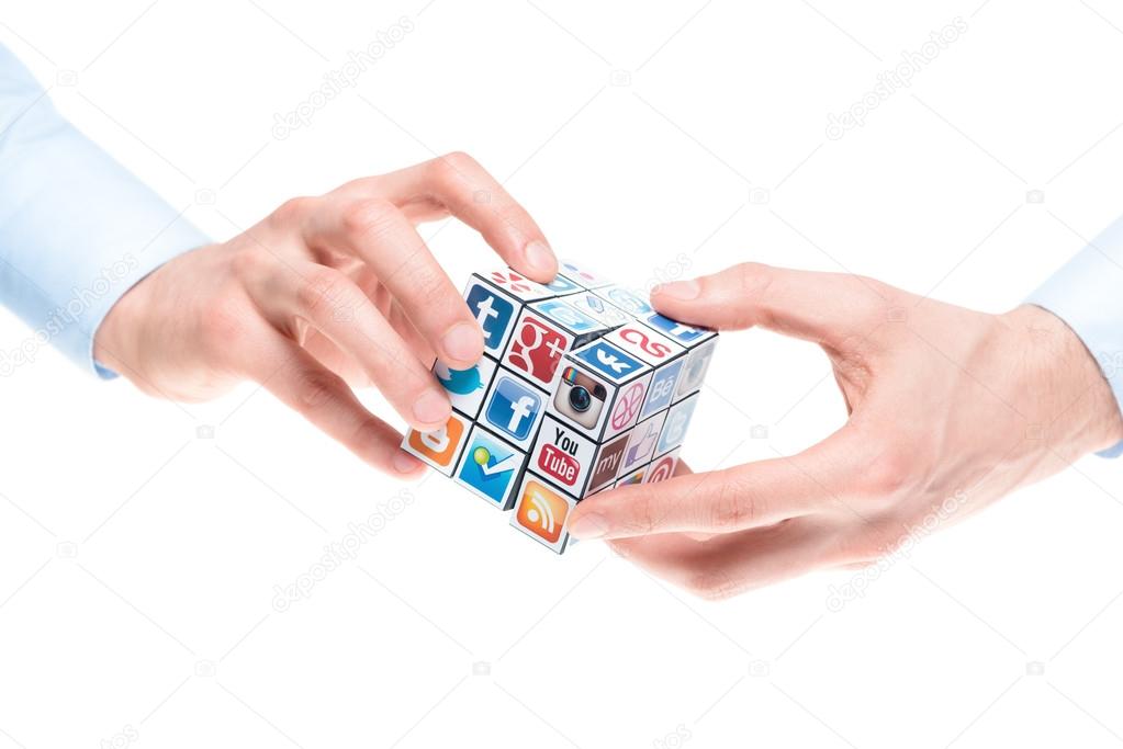 Kiev, Ukraine - February 2, 2013: A hands holding rubik's cube with logotypes of well-known social media brand's.