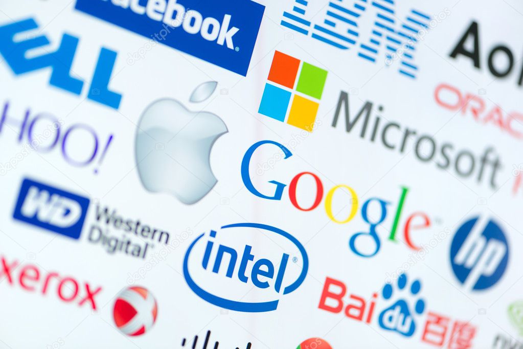 KIEV, UKRAINE - JUNE 12, 2014: A logotype collection of well-known world top companies of computer technologies on a monitor screen. Include Google, Apple, Microsoft, Intel and other logo.