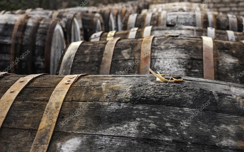 Open air picture of oak casks with madeira wine while maderization on sorarium