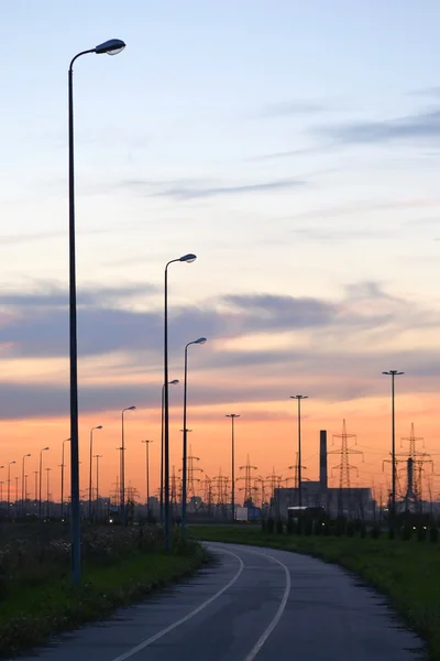 Zonsondergang op de weg — Stockfoto