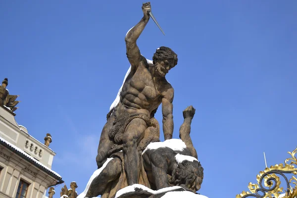 Hradcany castle and Battling Titan statue — Stock Photo, Image