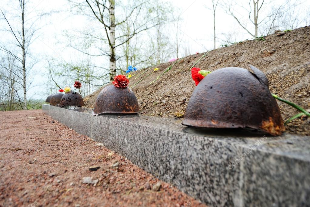 Old steel helmet on war memorial