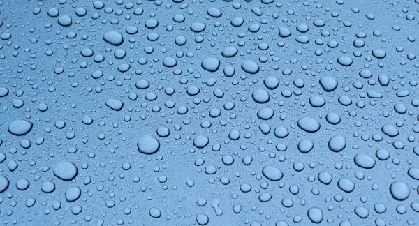 Modrá voda kapky pozadí textury — Stock fotografie