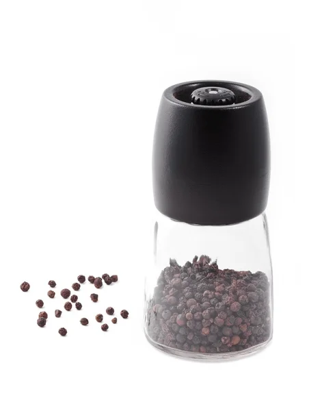 Black peppercorns and mill — Stock Photo, Image