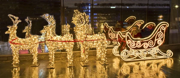 Electric deers and carriage with Santa Claus — Stock Photo, Image