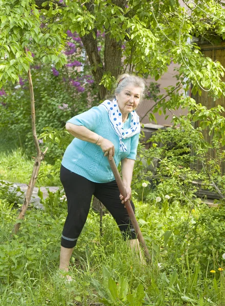 Old lady in garden — Stock Photo, Image