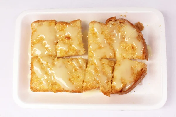Zapiekana bulka chleba z masłem i mleko skondensowane słodzone — Zdjęcie stockowe