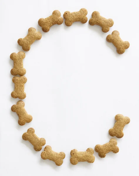 Bone Shape Dog food Letter C — Stock Photo, Image