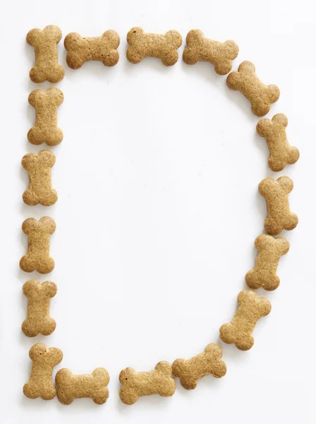 Bone Shape Dog food Letter D — Stock Photo, Image