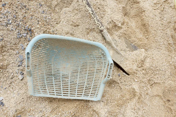 Shovel on sand background — Stock Photo, Image