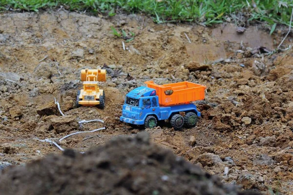 Plastic toy truck on the ground