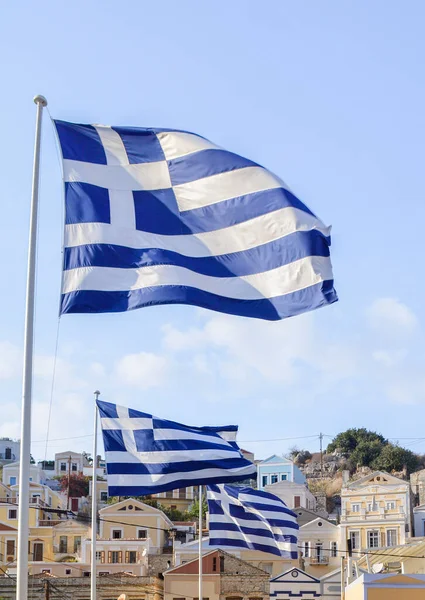 Banderas Griegas Ondeando Sobre Los Tejados Isla Symi —  Fotos de Stock