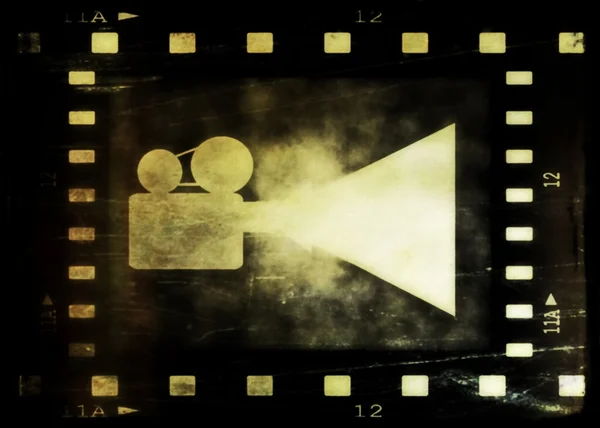 Moldura de tira de filme antigo e projetor de filme — Fotografia de Stock