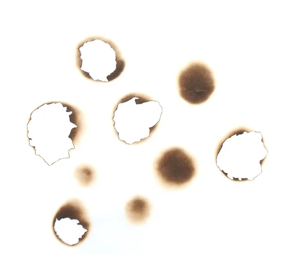 Set de agujeros quemados aislados sobre fondo blanco y textura — Foto de Stock