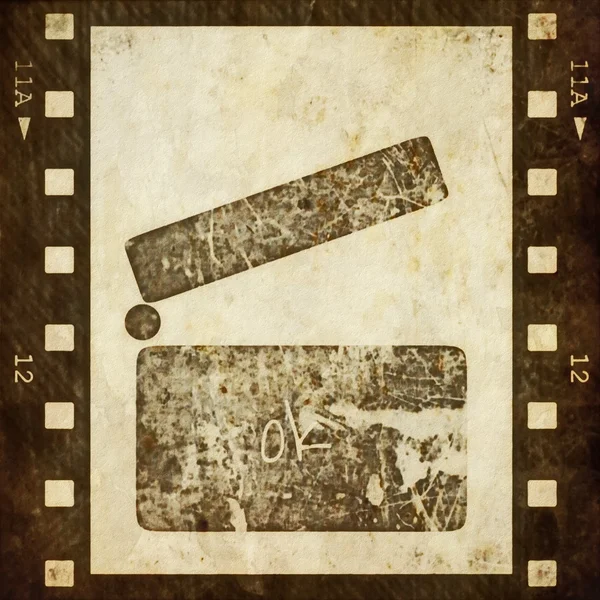 Clapper board and old grunge film strip background — Stock Photo, Image