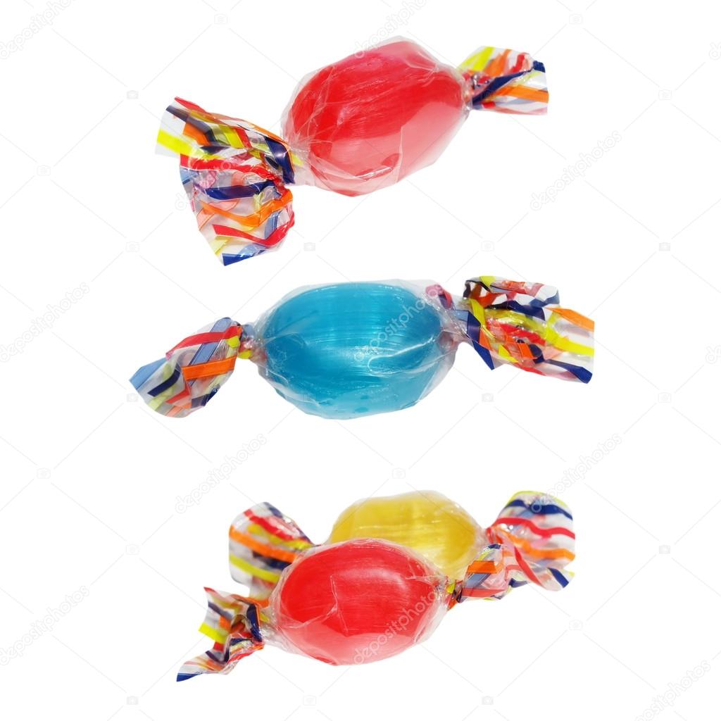 Wrapped candies with transparent cellophane isolated on white background (with clipping path)