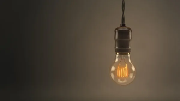Vintage hanging light bulb over dark background — Stock Photo, Image