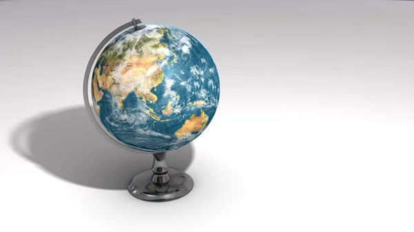 A realistic globe on a chrome pedestal over white B — Stock Photo, Image