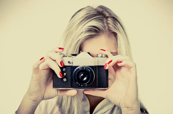 Woman with old camera Royalty Free Stock Images