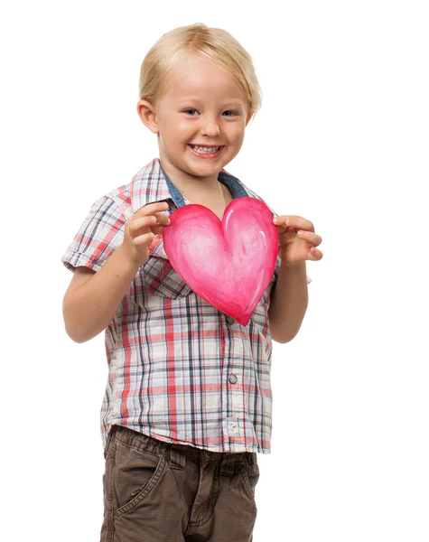 Cute young boy holding love heart — Stock Photo, Image