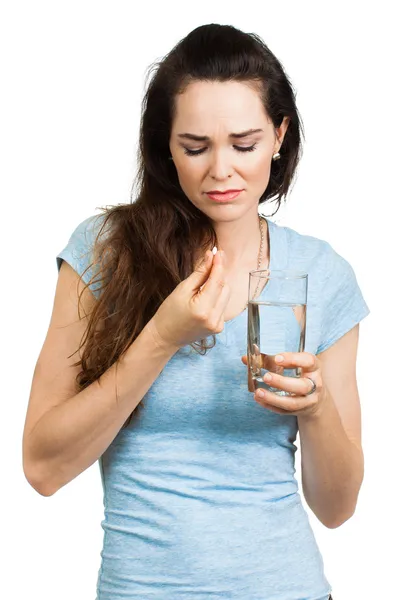 Woman in pain about to take pill. — Stock Photo, Image