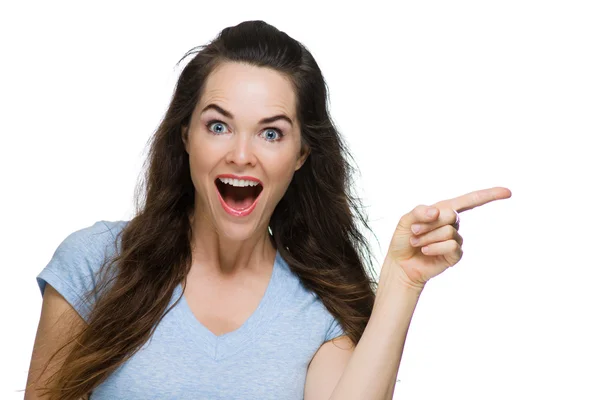 Happy surprised woman pointing — Stock Photo, Image