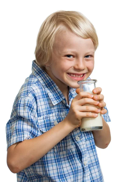 Happy cute boy drinking bottle of milk. — Stock Photo, Image