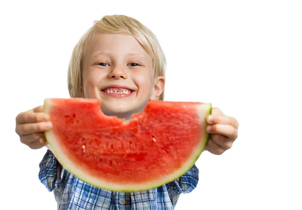 Cute boy peeking through hole in water melon — Stock Photo, Image